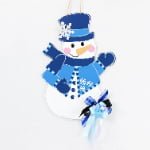 Blue Snowman MDF Christmas Door Hanger – Winter Holiday Front Door & Wall Decoration - Main View